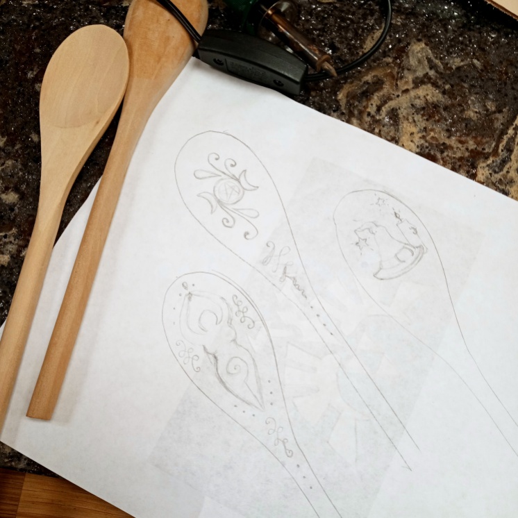 Sketching out the designs for witchy wooden spoons